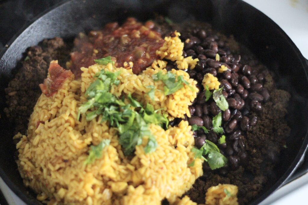 Rice, beans, cilantro, salsa, in skillet