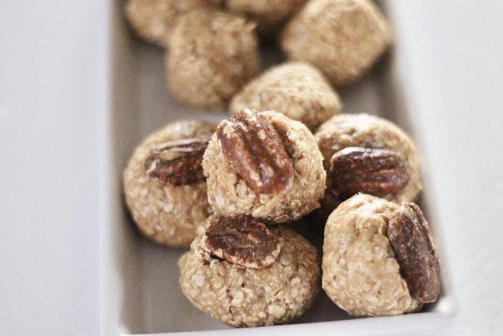 Oatmeal peanut butter balls with whole pecan on top