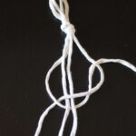 Macrame rope being tied in knot