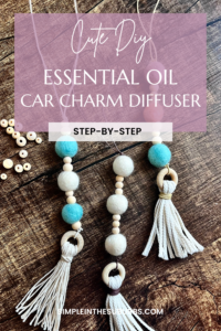 3 car charm diffusers on wood table