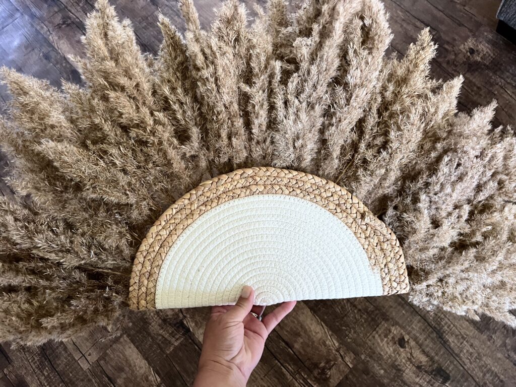 Diy pampas grass home decor piece held by woman’s hand